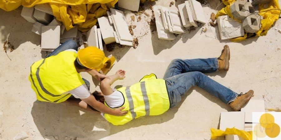 Workers' compensation worklace injury scene of employee helping injured colleague