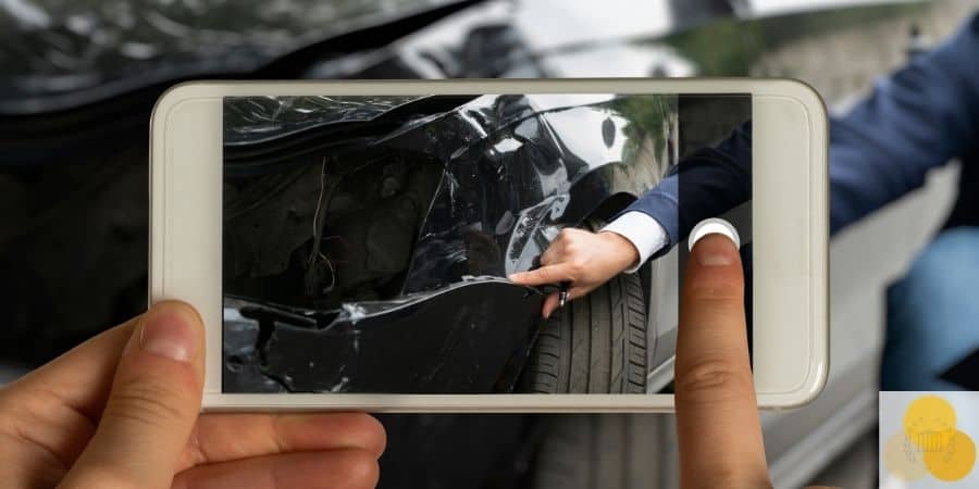 Person taking picture of car crash